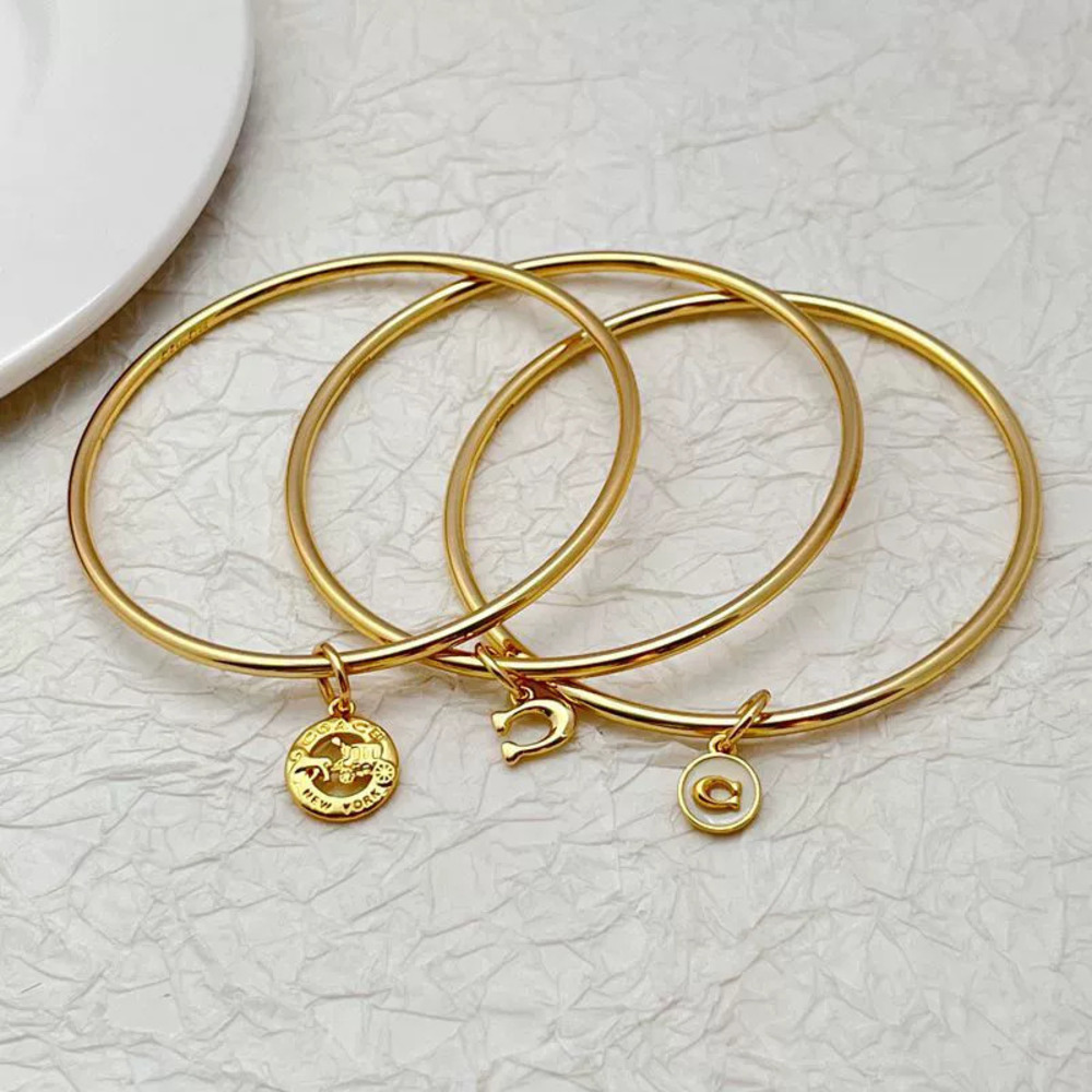 Coach Gold Plated Copper 3-in-1 TripleRing Bracelet Inlaid Letter Carriage Shape